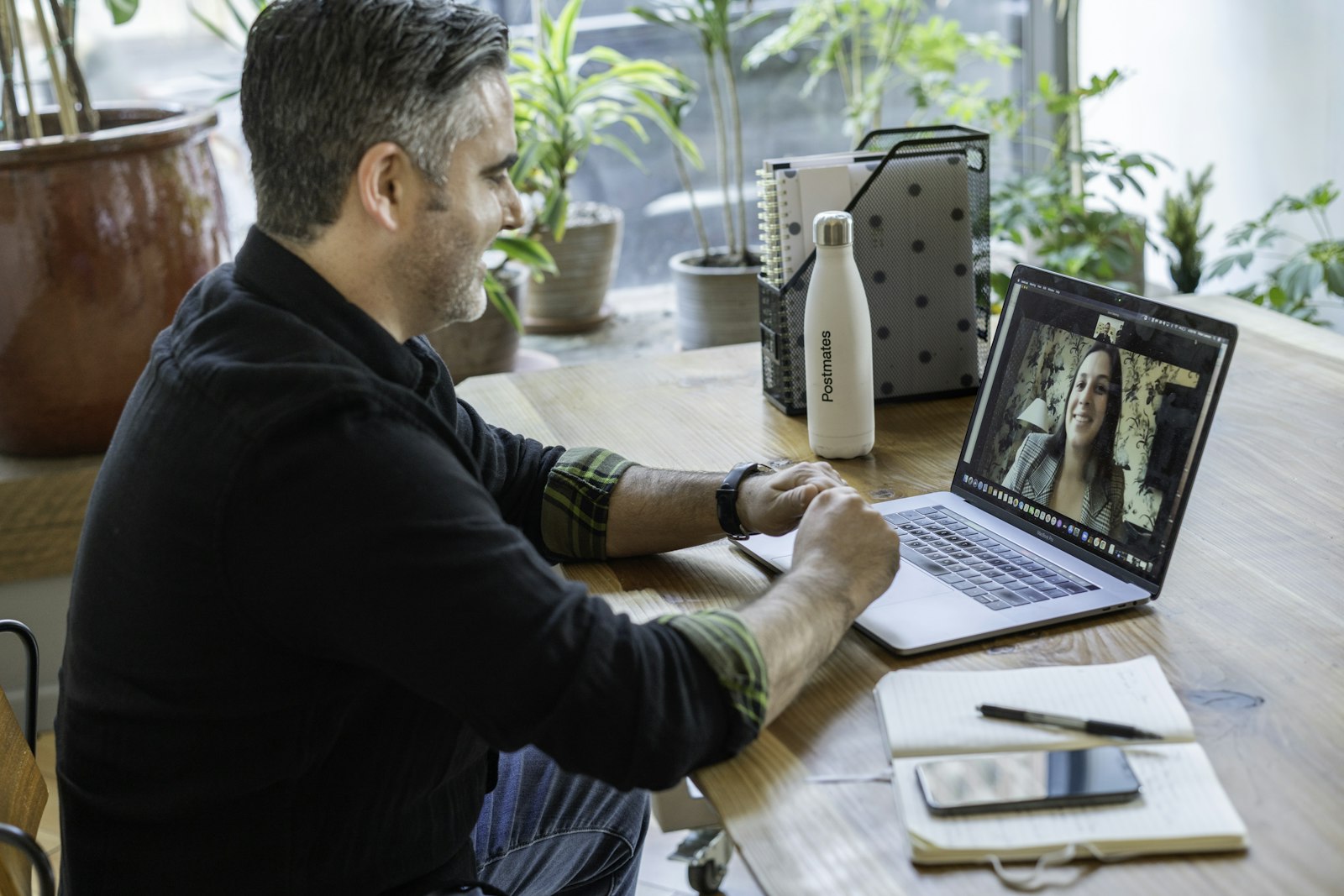 Product manager recording a video application at his desk